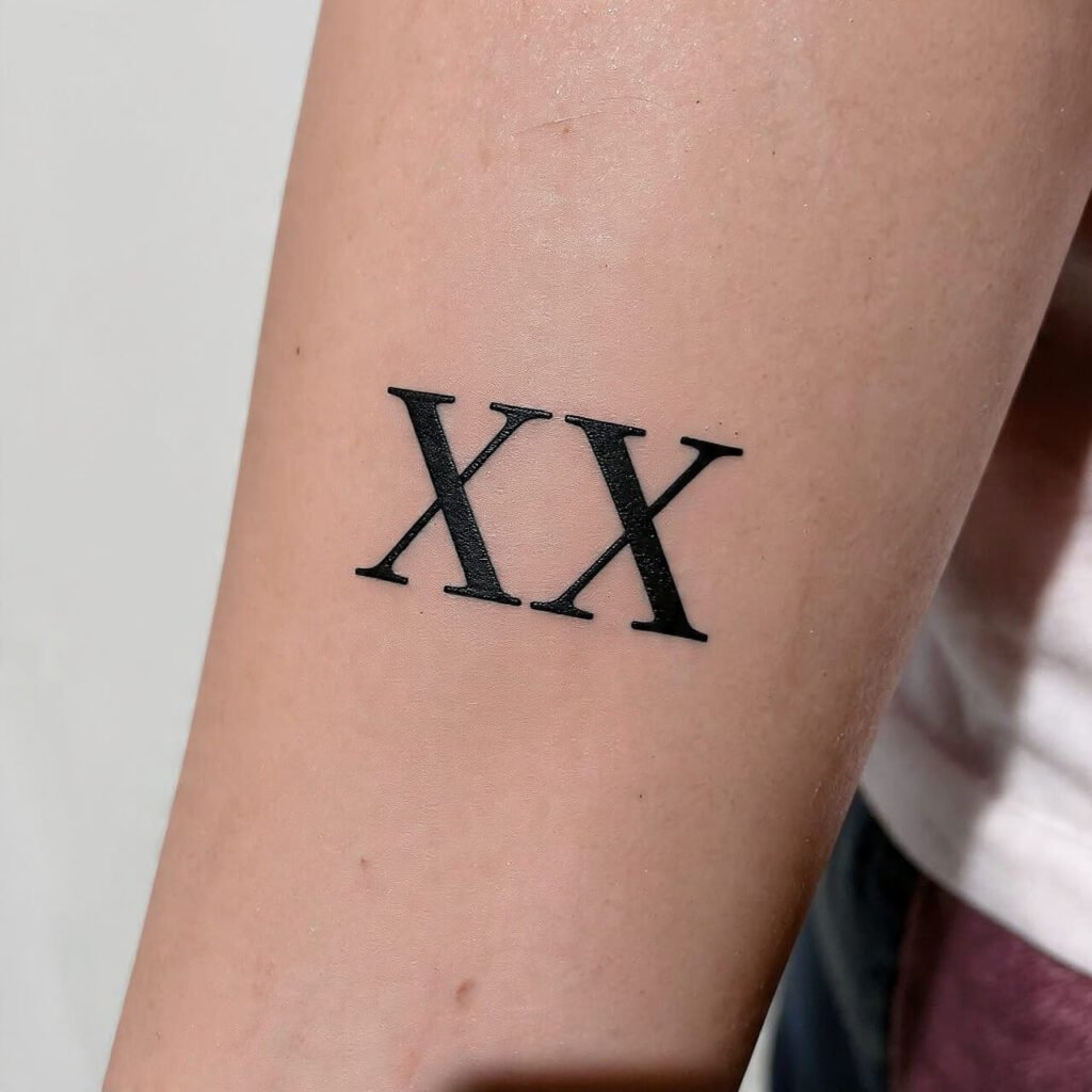 Roman Numerals with Weight tattoo
