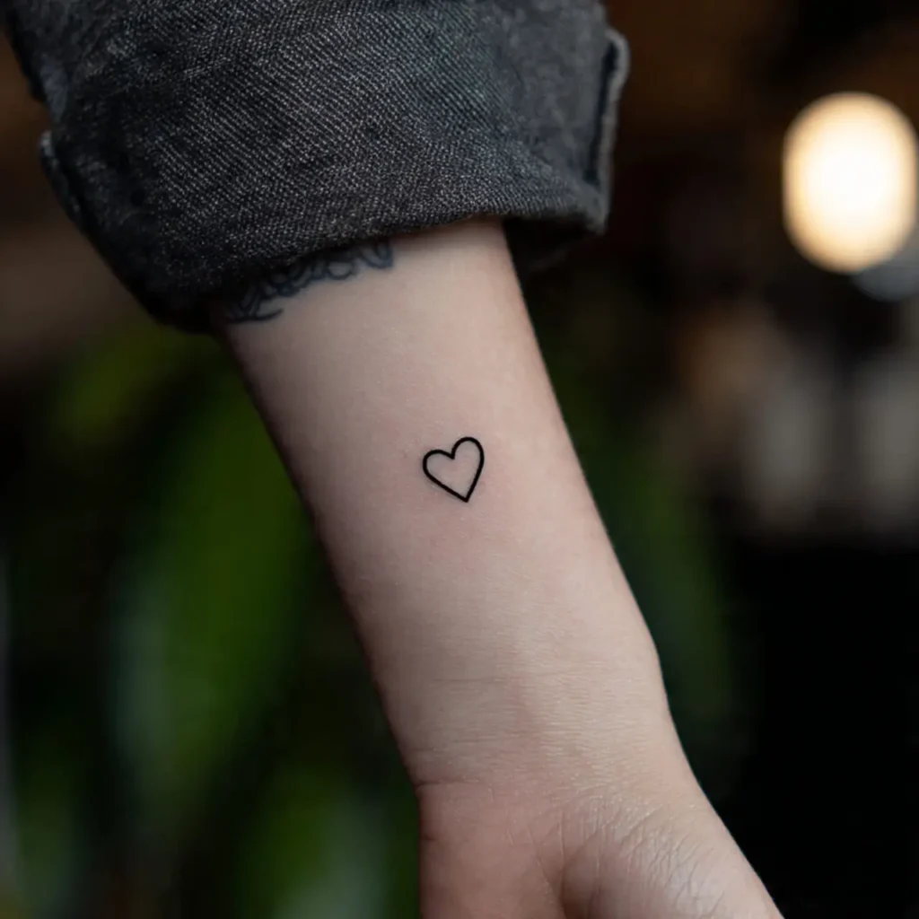 Tiny Black Heart tattoo