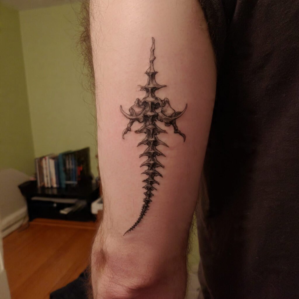 Vertical Spine-Inspired Linework Tattoo