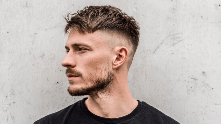 Low Fade with Messy Fringe and Light Goatee