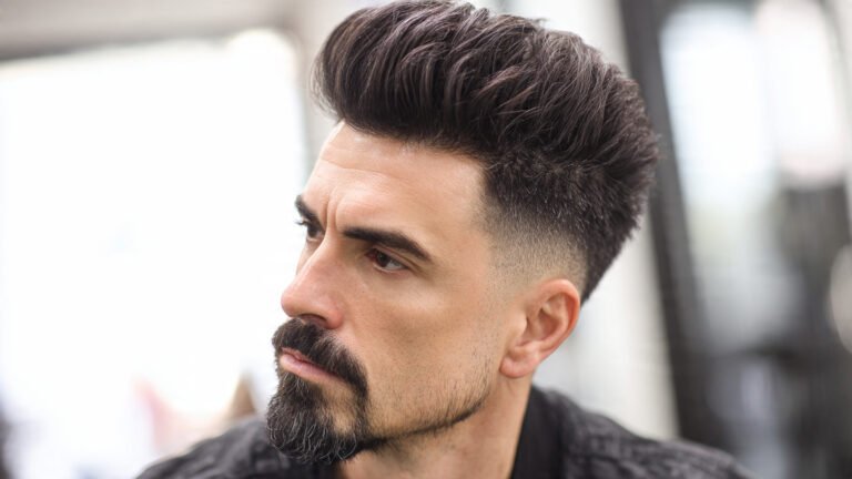  Low Skin Fade with Pompadour and Bold Goatee