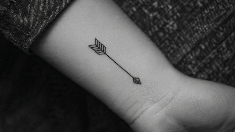 Minimalist Arrow Wrist Tattoo