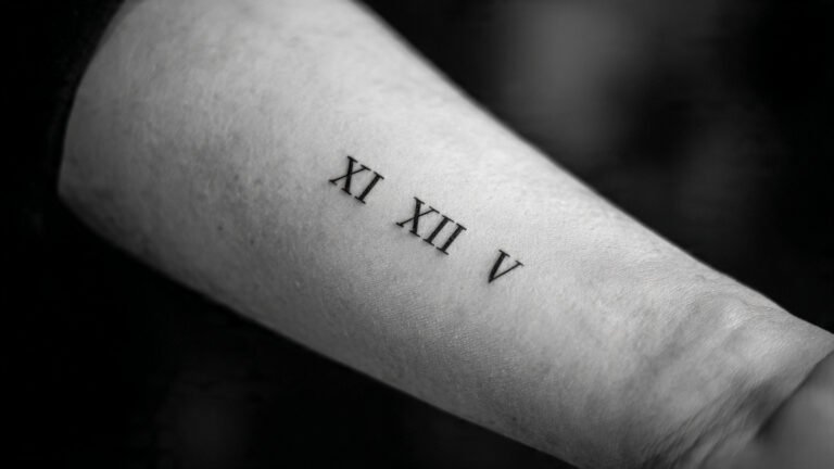 Minimalist Roman Numeral Tattoo