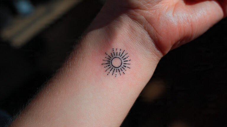 Minimalist Sun Symbol Tattoo