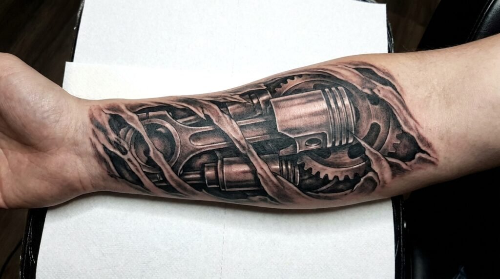 biomechanical forearm tattoo